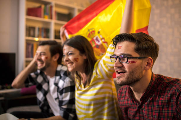 istock Spanish supporters rejoices watching television 1063121362