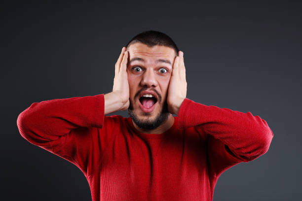 istock Portrait of surprised young man studio shot 1063129956