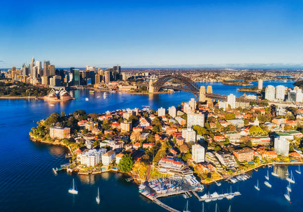 D SY Kurraba High Yachts CBD Lower North Shore Kirribilli wealthy suburb in Sydney around Sydney harbour near the Harbour bridge towards city CBD landmarks in aerial view over waterfront with yacht club and local marina. north shore stock pictures, royalty-free photos & images