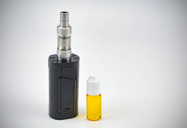 istock E - cigarette for vaping , technical devices.The liquid in the bottle 1063139382