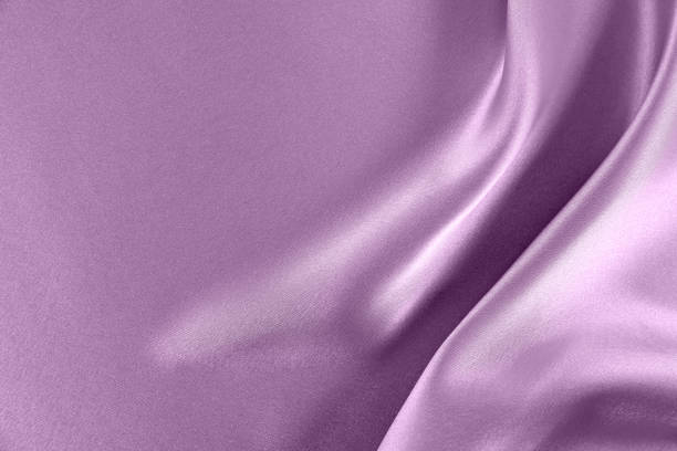 istock Lilac draped smooth satin fabric backgrounds for the holiday 1063154332