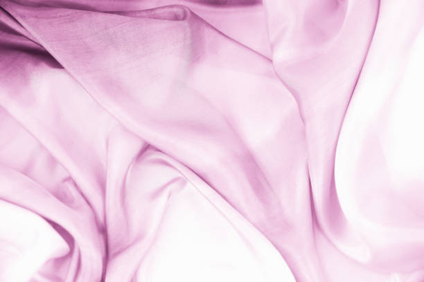 istock Lilac draped smooth satin fabric backgrounds for the holiday 1063154340