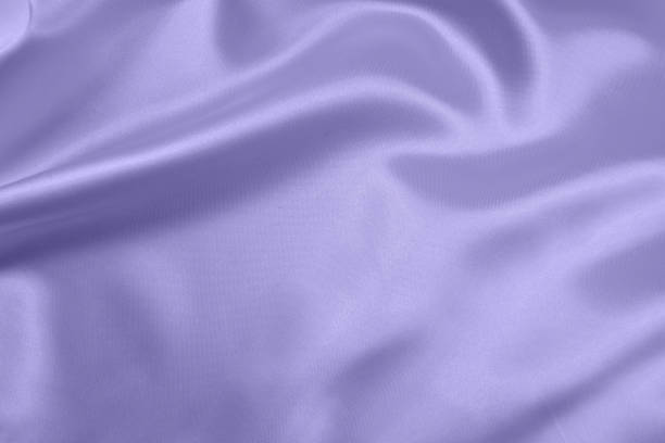 istock Lilac draped smooth satin fabric backgrounds for the holiday 1063155424