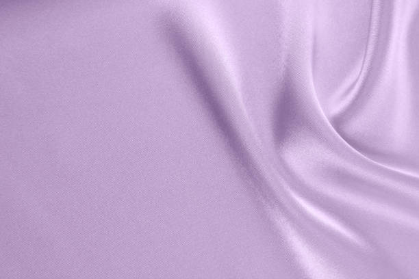 istock Lilac draped smooth satin fabric backgrounds for the holiday 1063155462