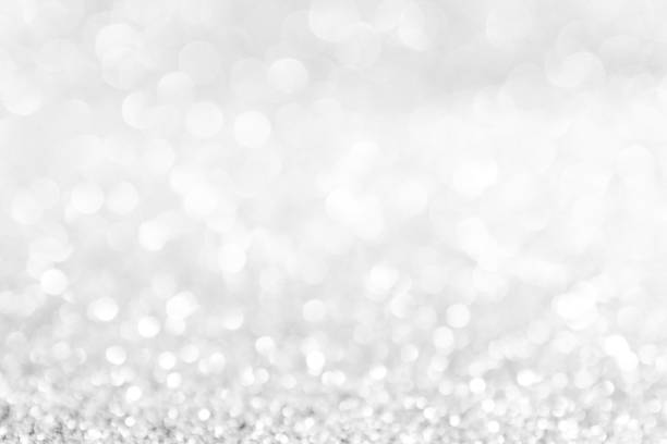 istock abstract background white Silver lights on christmas bokeh 1063175480