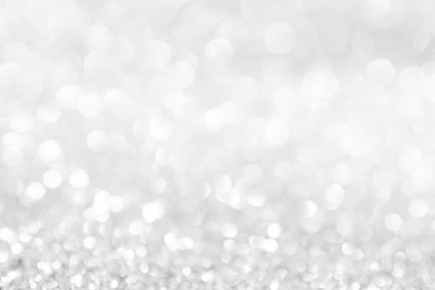 istock abstract background white Silver lights on christmas bokeh 1063175654