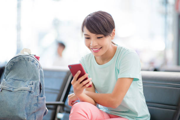 istock woman use phone happily 1063178668