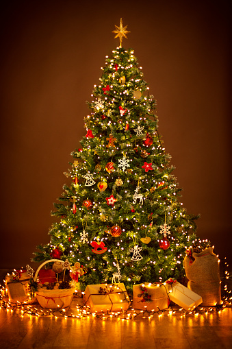 Christmas Tree lighting in night, Xmas Decorations Hanging on Chritmastree, Star Top Light and Present Gifts