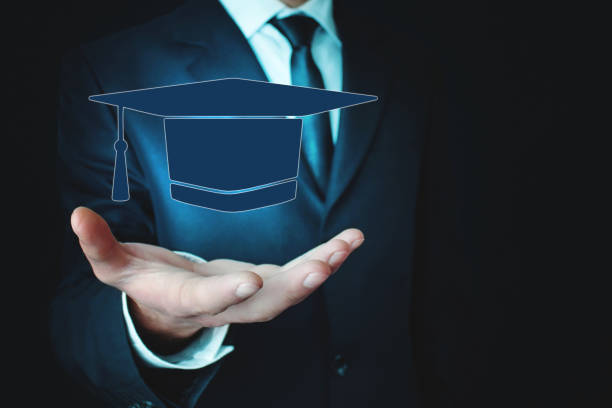 istock Man holding graduation cap. Education concept 1063207930