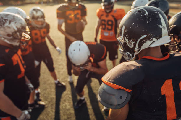 istock Football Players During Time Out 1063209954