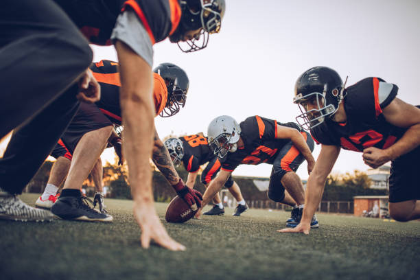 istock Football players playing a match on a field 1063210270