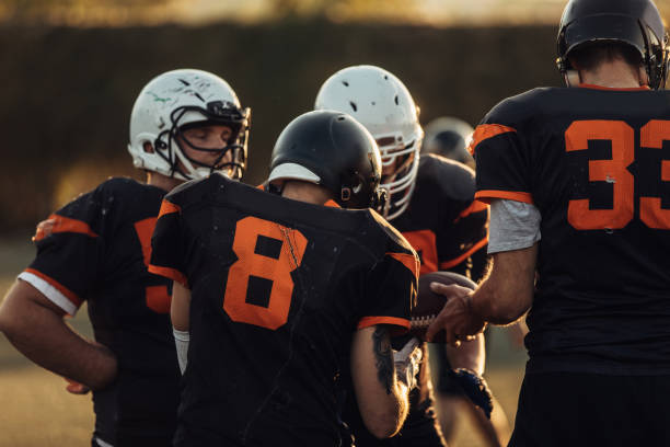 istock Football Players During Time Out 1063210388
