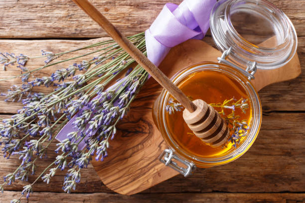 istock fragrant fresh lavender honey in a glass jar close-up. horizontal top view 1063210396