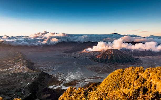 Magnificent Mount Bromo Volcano Landscape Mount Bromo landscape view in early morning with fog and cloud background. Ring Of Fire stock pictures, royalty-free photos & images