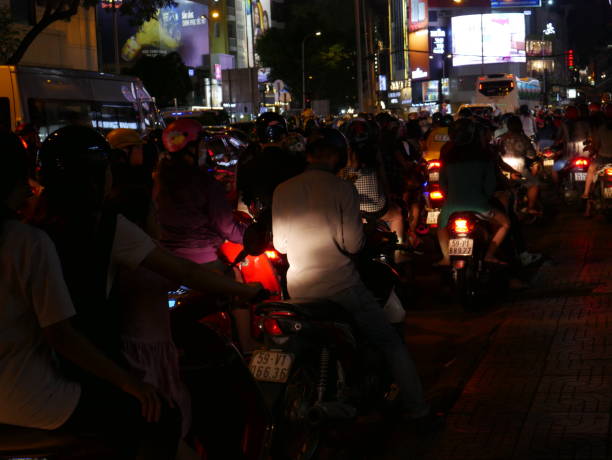 night traffic and ads in vietnam - developing countries urban scene outdoors horizontal imagens e fotografias de stock