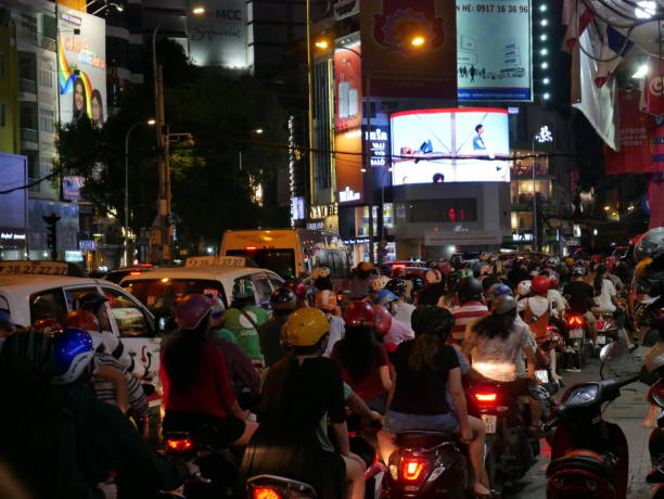 night traffic and ads in vietnam - developing countries urban scene outdoors horizontal imagens e fotografias de stock