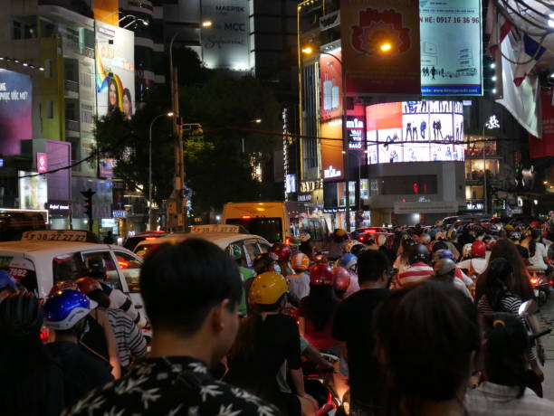 night traffic and ads in vietnam - developing countries urban scene outdoors horizontal imagens e fotografias de stock