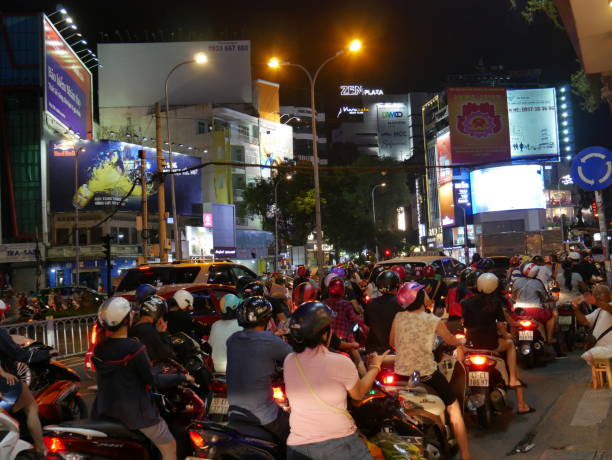 night traffic and ads in vietnam - developing countries urban scene outdoors horizontal imagens e fotografias de stock