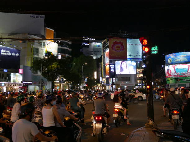 night traffic and ads in vietnam - developing countries urban scene outdoors horizontal imagens e fotografias de stock