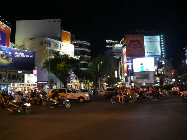 night traffic and ads in vietnam - developing countries urban scene outdoors horizontal imagens e fotografias de stock