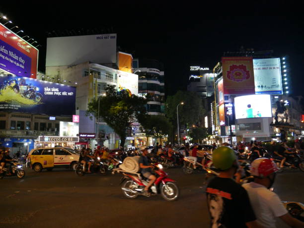 night traffic and ads in vietnam - developing countries urban scene outdoors horizontal imagens e fotografias de stock