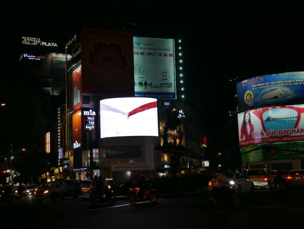 night traffic and ads in vietnam - developing countries urban scene outdoors horizontal imagens e fotografias de stock