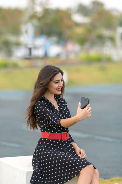 istock Young woman taking a selfie 1063216020