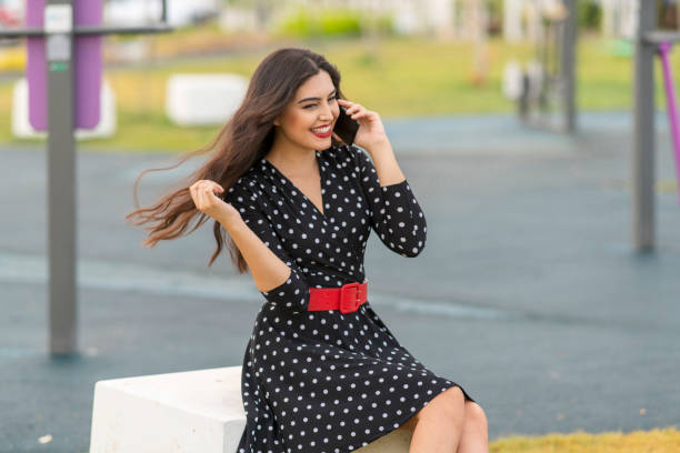 istock Young beautiful woman using mobile phone 1063217566