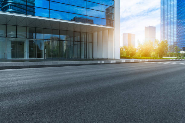 istock City empty road with modern buildings background 1063221172