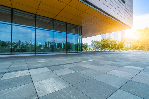 istock Empty brick road nearby office building 1063221598