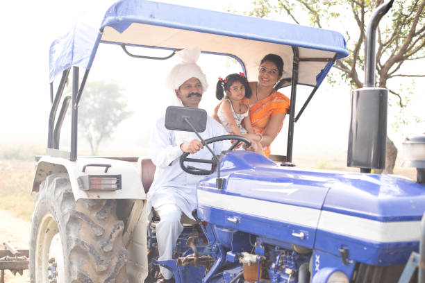 istock Indian family on tractor 1063221886