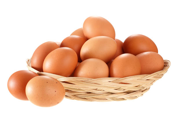 istock Eggs in a wicker basket. Isolated on white background. 1063225552