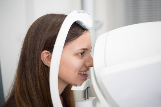 istock Optometrist checking young patient vision at eye clinic. 1063230500