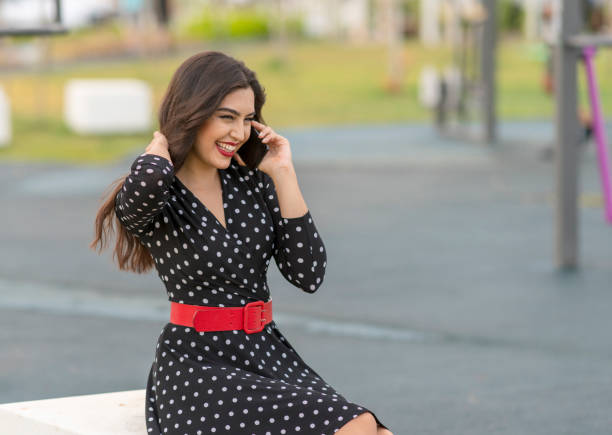istock Young beautiful woman using mobile phone 1063230564