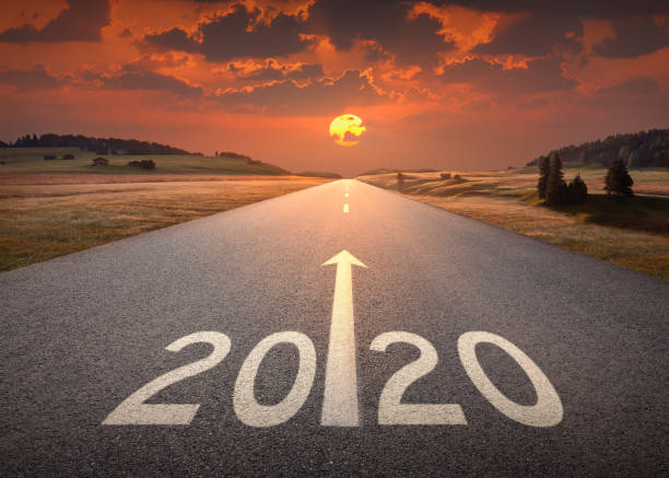 istock 2020 new year at beautiful empty highway at sunset 1063230892