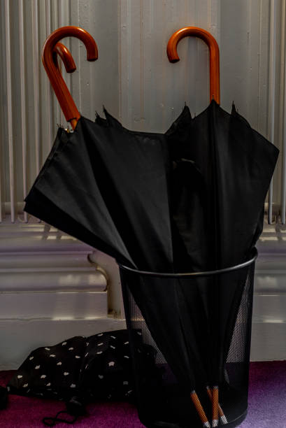 istock Umbrellas in a rainy day waiting to be picked up 1063232178