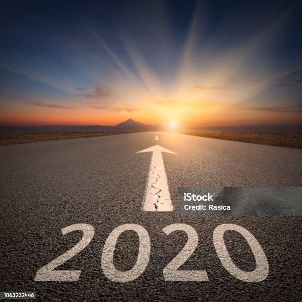 Driving To Upcoming 2020 On Open Road At Sunrise Stock Photo - Download Image Now - 2020, Aspirations, The Way Forward