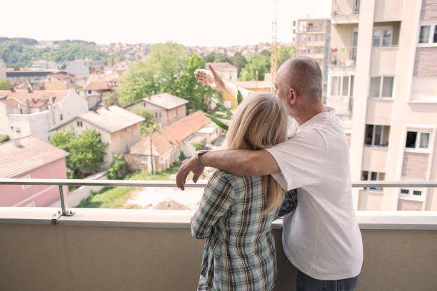 istock Middle aged couple moving into new apartment. 1063234268
