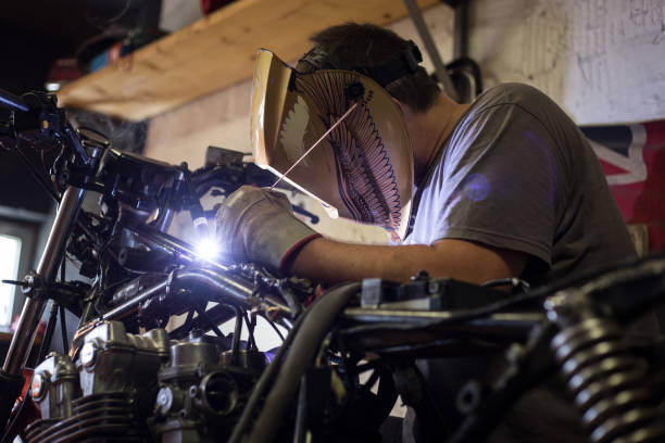 istock Man made transformation on custom bike 1063235194