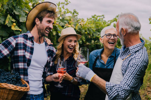 istock Smiling senior and young couple in a vineyard 1063236702
