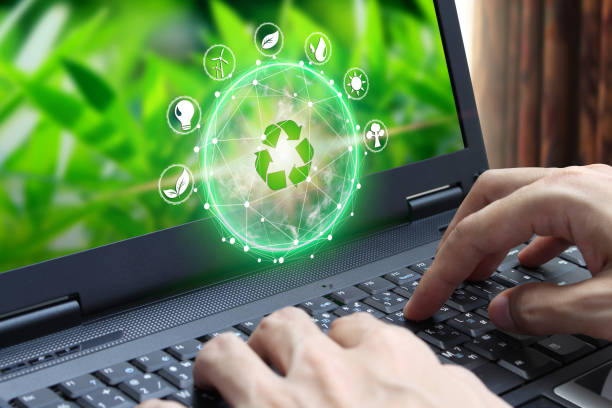 istock Hand use laptop computer with environment Icons over the Network connection 1063239004