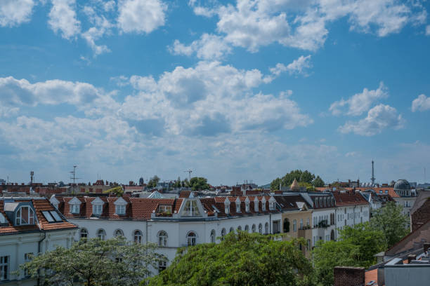 istock rooftops,  blue sky and skyline and city panorama 1063239640
