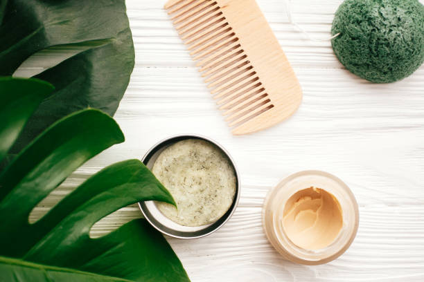 istock Natural eco friendly solid shampoo bar, wooden brush,  deodorant,soap, konjaku sponge on white wood with green monstera leaves. Zero waste products plastic free 1063241408