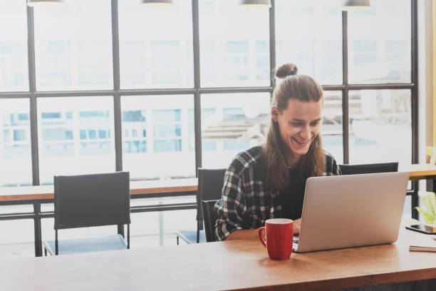 istock freelance working in coffee shop, Nomad worker conceptual 1063247920