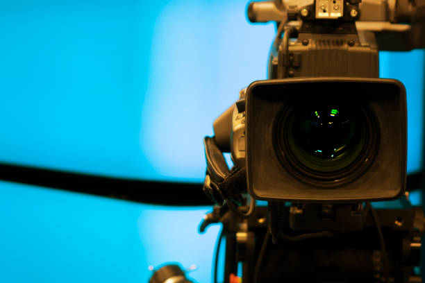 istock Close-up of a Television Camera lens in a blue screen studio environment. 1063248410