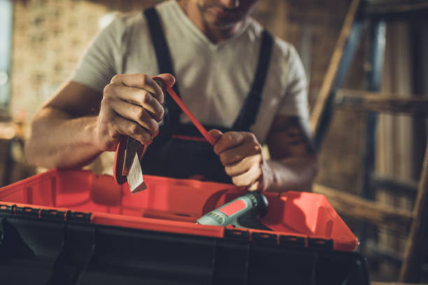 istock Close up of manual worker packing his equipment into the toolbox. 1063250582