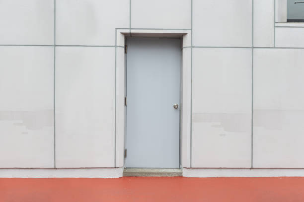 istock sidewalk by street wall & door 1063252516