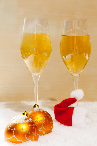 istock champagne glasses, christmas balls and Santa´s hat 1063253350