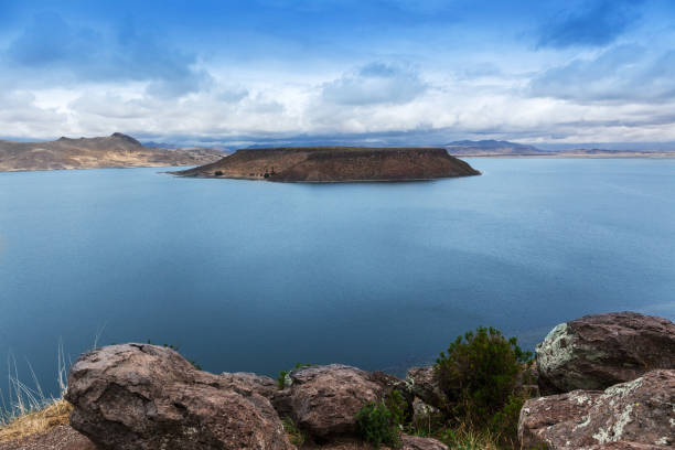 istock beautiful island in mountain lake 1063255242