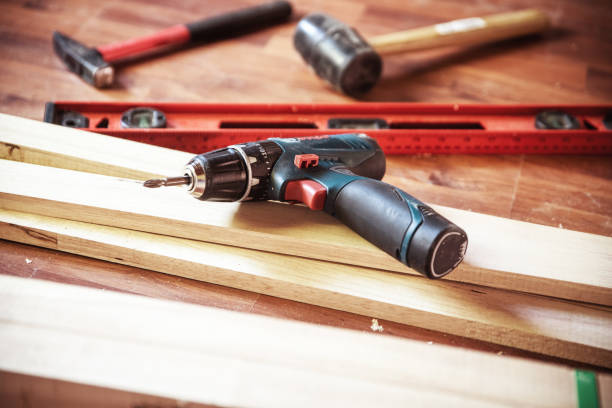 istock Building DIY with hammer while hit the nail Professional carpenter working with wood and building tools in house for renovate. 1063255582